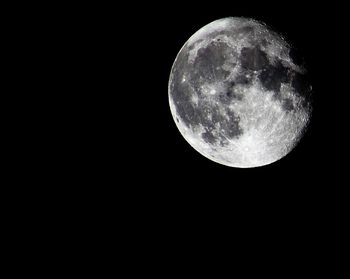 Scenic view of moon against black sky