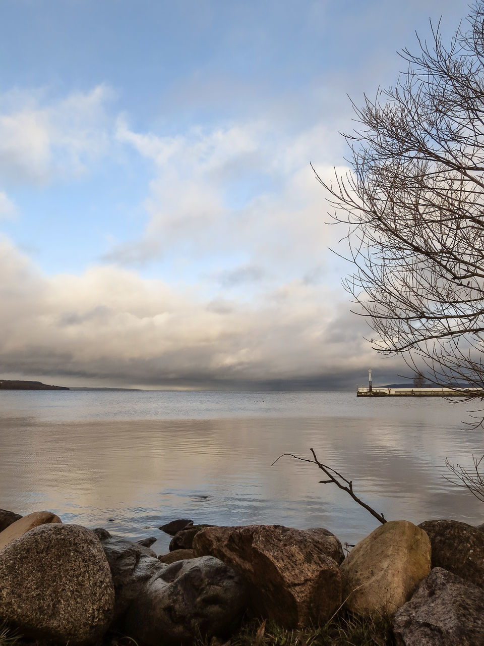 water, sky, sea, tranquility, tranquil scene, scenics, beauty in nature, cloud - sky, rock - object, shore, nature, beach, horizon over water, idyllic, sunset, cloud, cloudy, outdoors, non-urban scene, calm