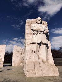 Low angle view of statue against sky