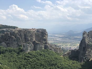 Scenic view of landscape against cloudy sky