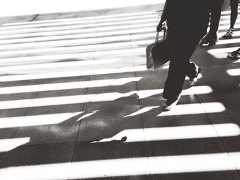 Low section of people walking on road