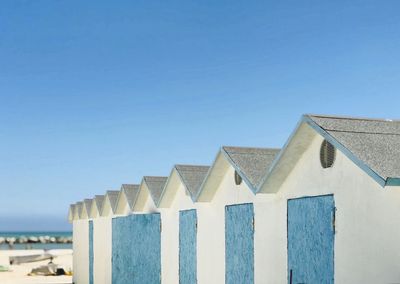 Low angle view of building against clear blue sky