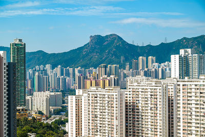 Modern buildings in city against sky