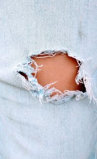 Close-up of human hand against white wall