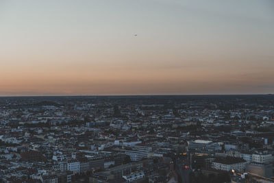 High angle view of city against sky during sunset