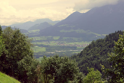 High angle view of trees and mountains against sky