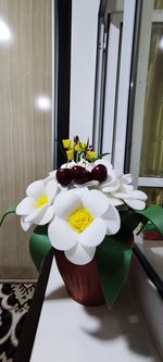 Flower vase on table at home