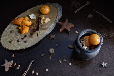 High angle view of nuts and spice on table during autumn season