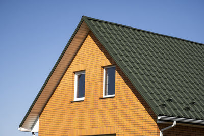 Low angle view of building against blue sky