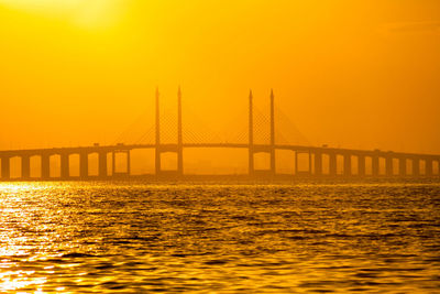 View of suspension bridge over sea