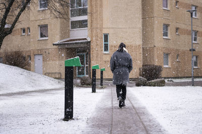 Woman walking in snowy weather