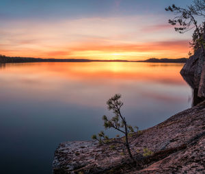 Scenic view of lake against sky during sunset