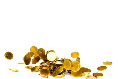Close-up of coins against white background