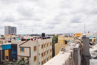 Buildings in city against sky