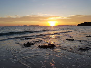 Scenic view of sea against sky during sunset