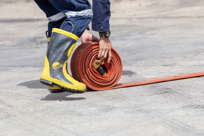 Low section of man working on road