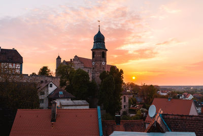 View of buildings against sky at sunset