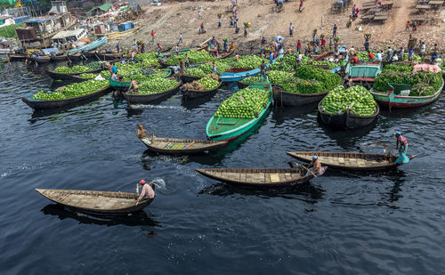 High angle view of boats with fruits in river