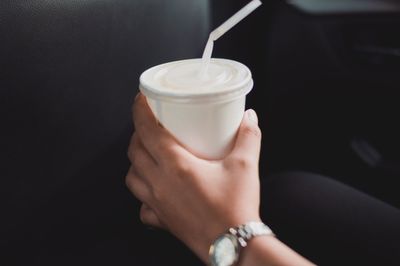 Close-up of woman holding drink