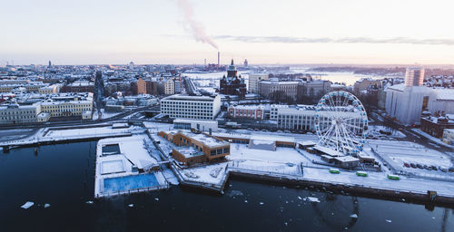 High angle view of buildings in city during winter