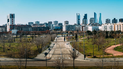 View of buildings in city against clear sky