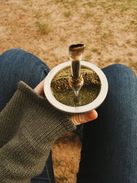 Midsection of woman holding mate
