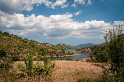 Scenic view of lake and trees against sky