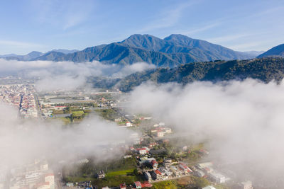 High angle view of city buildings against sky