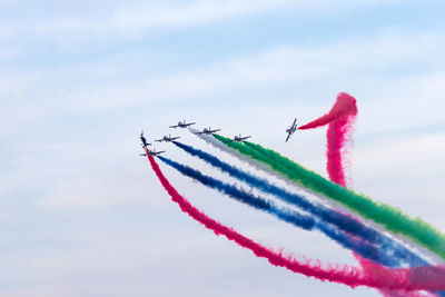 Al fursan aerobatic team doing stunts in the sky in abu dhabi, uae