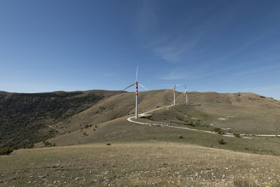 Scenic view of landscape against blue sky