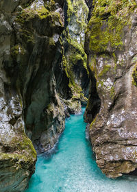 Scenic view of sea by cave