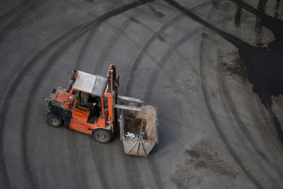 High angle view of worker working on cable car