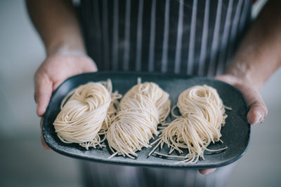 Midsection of person preparing food