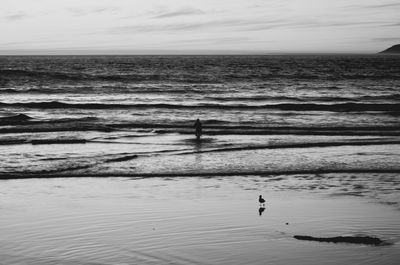 View of calm sea against cloudy sky