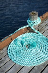 High angle view of fishing net on wooden post