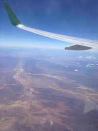 Aerial view of airplane flying in sky