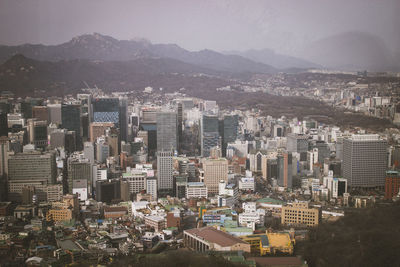 High angle view of buildings in city against sky in seoul, south korea