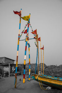 Multi colored umbrella on land against clear sky