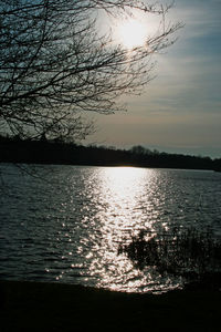 Scenic view of lake against sky at sunset