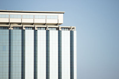 Low angle view of modern building against clear sky