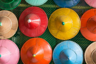 High angle view of multi colored hats at market for sale