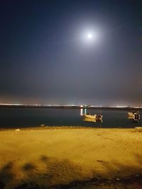 Scenic view of sea against sky at night