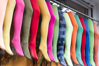 Colorful stockings hanging on rack at store