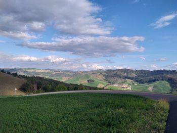 Scenic view of agricultural field against sky