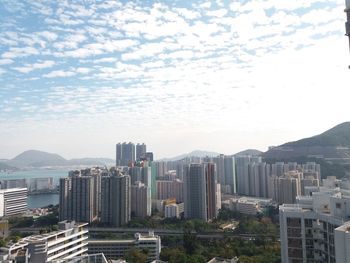 Modern buildings in city against sky