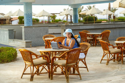 Empty chairs and tables in restaurant