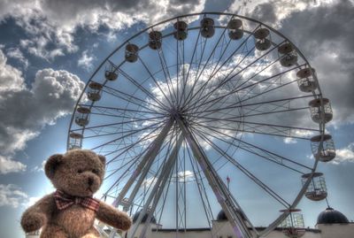 Low angle view of ferris wheel against sky