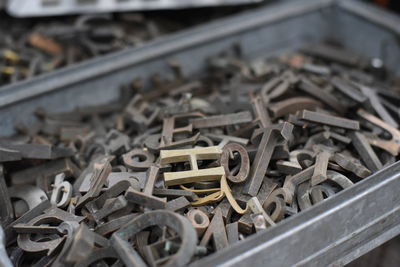 Close-up of wooden alphabets in container