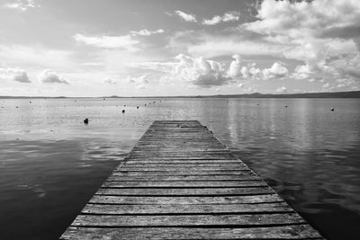 Pier over sea against sky