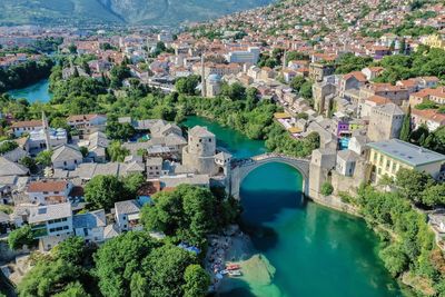 High angle view of river amidst buildings in town